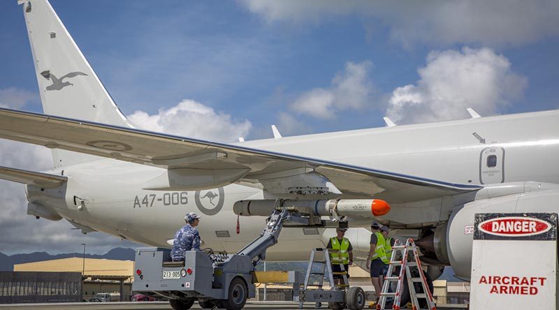 Royal Australian Air Force crew from No. 11 Squadron load an ATM-84J Harpoon on to their P-8A Poseidon at Marine Corps Base Hawaii before a live-fire opportunity during RIMPAC 18. Photo by Corporal Nicci Freeman.