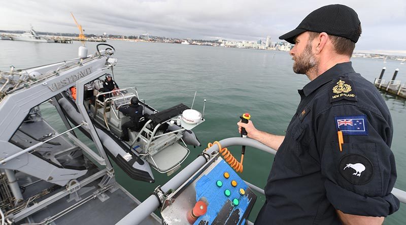 Chief Petty Officer Stephen 'Penny' Lane demonstrates the RHIB handling crane on the Royal New Zealand Navy’s new seamanship training facility at Devonport Naval Base. NZDF photo.