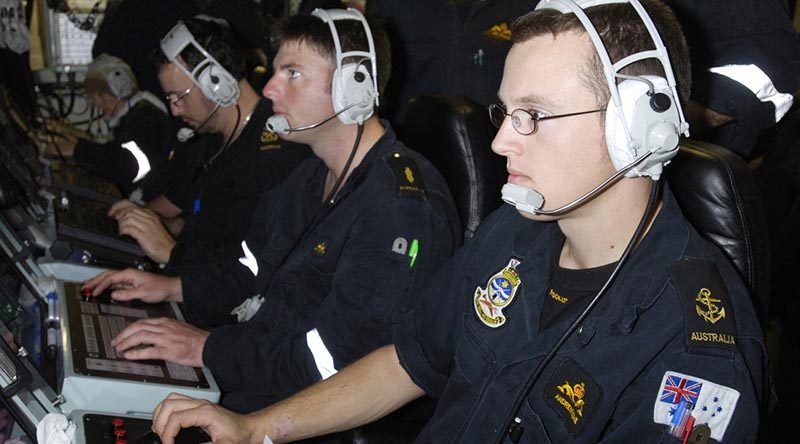 Leading Seaman Accoustic Warfare Analyst Underwater Controller 2nd in charge (LSAWA U/C2) Andrew Hume at a sonar console on HMAS Farncomb. Photo by Able Seaman Lincoln Commane.