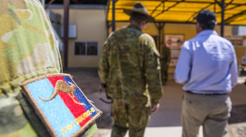 Commander Task Group Taji-7, Australian Army Colonel Michael Say briefs Minister for Defence Personnel Darren Chester at the Taji Military Complex in Iraq. Photo by US Army Specialist Audrey Ward.