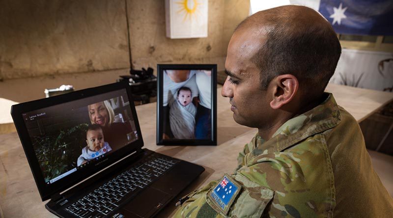 Australian Army officer Major Varun Singh talks to family in Australia via Skype from the Taji Military Complex, Iraq. Photo by Corporal David Said.