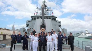 HMNZS Te Mana operations and weapons teams with the Naval Surface Fire Support Rodeo trophy.