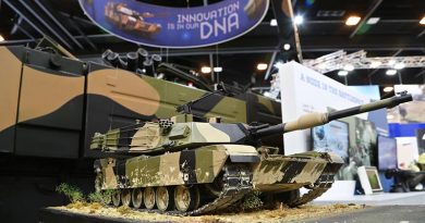 An Abram MBT model displayed in front of an Ajax Abrams-based Project LAND 400 Phase 3 contender at Land Forces 2018 in Adelaide. Photo by Brian Hartigan.