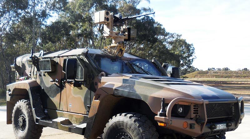 In July 2018 the R150 was succesfully integrated into a Hawkei vehicle (pictured) and conducted live fire stationary and moving shots. EOS photo.