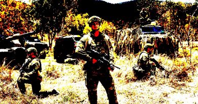 Australian Army soldiers Private Luke Peters (standing), Corporal Rory Dek (left) and Private Luke Bryant at Lavarack Barracks, Townsville. Photo by Sergeant Janine Fabre.