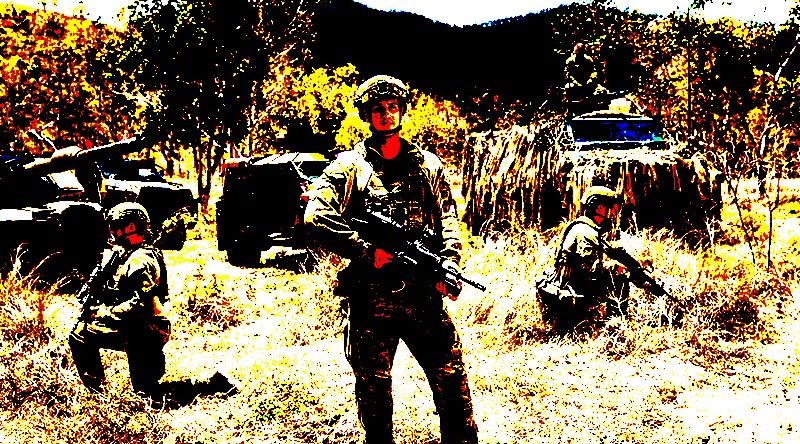 Australian Army soldiers Private Luke Peters (standing), Corporal Rory Dek (left) and Private Luke Bryant at Lavarack Barracks, Townsville. Photo by Sergeant Janine Fabre.