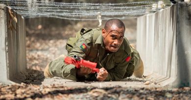 A soldier from the Republic of Fiji Military Forces crawls under an obstacle during Exercise Hydra at Enoggera Barracks in Brisbane. Photo by Corporal Nunu Campos.