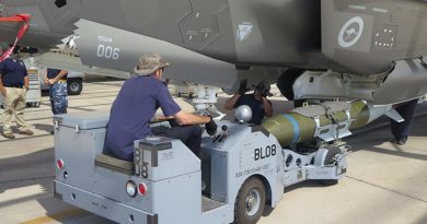 Lockheed Martin personnel load one of the first inert GBU-31 guided bombs into an Australian F-35A Joint Strike Fighter. Photo by Larone Thomas.