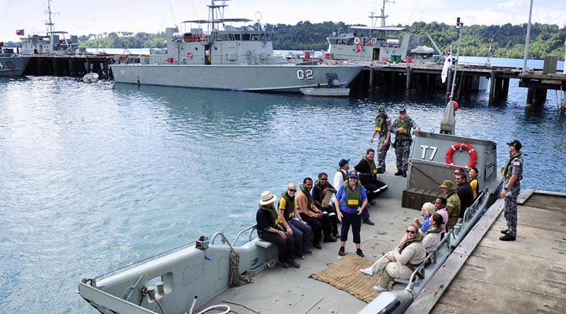 Manus Island Regional Processing Centre (MIRPC) staff board an Australian landing craft Lombrum Naval Base, Manus Island. Photo by Sergeant W Guthrie.