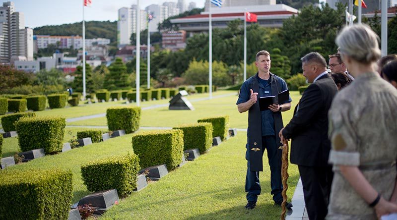 Chaplain Class 4 Russell Bone delivers a prayer in the United Nations Military Cemetary in Busan, Korea, to start the process of disinterring the bodies of two New Zealand service personnel who died and were buried in Korea. NZDF photo.