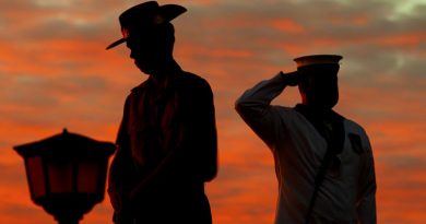An Army Catafalque Party member rests on arms reversed as a Navy bugler salutes during an Anzac Day dawn service at Monument Hill, Fremantle, Western Australia. ADF photo.