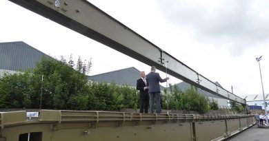 British VIPs examine a WFEL dry support bridge ready for shipment to the Australian Army. WFEL photo.