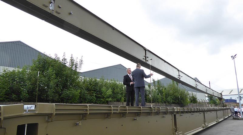 British VIPs examine a WFEL dry support bridge ready for shipment to the Australian Army. WFEL photo.