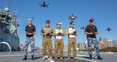 Drone racers, RAAF Officer Cadet Nicholas Eberl, Australian Army members Private Mackenzie Togo, Lieutenant Mark Sheppard and Lieutenant Thomas Gash, and RAAF Flight Sergeant Justin Galbraith, hover their drones over the flight deck of HMAS Canberra, to promote the inaugural Military International Drone Racing Tournament in the lead-up to Invictus Games. Photo by Able Seaman Leo Baumgartner.