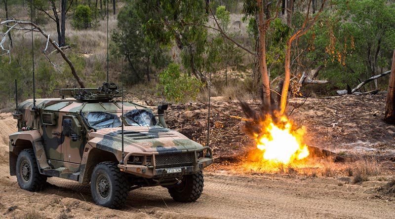 A simulated munition explodes next to an Australian Army Hawkei Protected Mobility Vehicle – Light during Land Trial 02-18 at the Townsville Field Training Area in north Queensland. Photo by Corporal Nunu Campos.