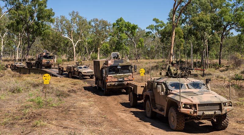 New Army Land 121 vehicles cross a new dry support bridge during Land Trial 02-18 in High Range Training Area, north Queensland. Photo by Corporal Nunu Campos.