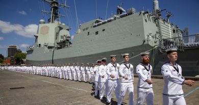 The commissioning crew of HMAS Brisbane march on to their new ship during a ceremony at Fleet Base East. Photo by Leading Seaman Nicolas Gonzalez.