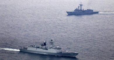 People's Liberation Army - Navy ship Xianning and HMAS Melbourne (background) during a passage exercise. ADF photo.