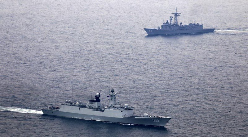 People's Liberation Army - Navy ship Xianning and HMAS Melbourne (background) during a passage exercise. ADF photo.