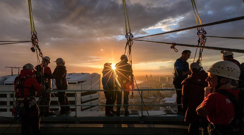 Sailors and officers from HMAS Success prepare to abseil from a Sydney skyscraper, raising funds for the Sir David Martin Foundation. Photo by Leading Seaman Kayla Jackson.