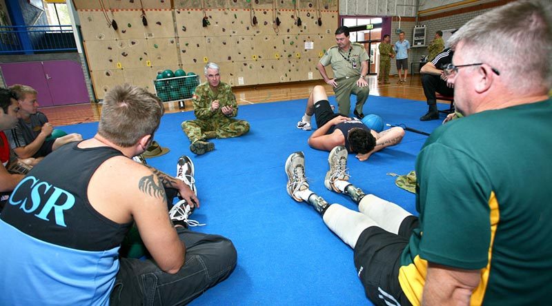 Then Chief of Army Lieutenant General Ken Gillespie and Commander Joint Health Command Major General Paul Alexander chat with participants in the ADF Paralympic Sports Program. Photo by Sergeant Brian Hartigan.