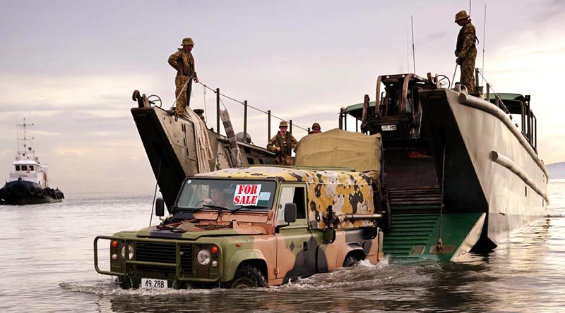 FILE PHOTO (November 2013): An Australian Army Land Rover lands on a beach in the Philippines during Operation Philippines Assist. Photo by Corporal Jake Sims (digitally altered by CONTACT).