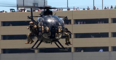 Special operations operators onboard an MH-6 Little Bird helicopter assault a simulated enemy position in an urban setting during a capabilities demo at the 2018 International Special Operations Forces week in Tampa, Florida. Photo by US Air Force Master Sergeant Barry Loo.