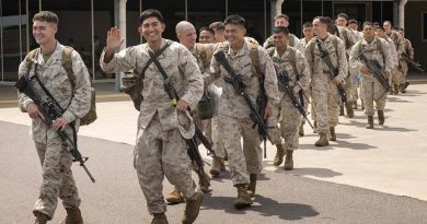 Personnel of the Marine Rotational Force - Darwin prepare to board their flight home from RAAF Darwin, Northern Territory. Photo by Sub Lieutenant Max Logan.