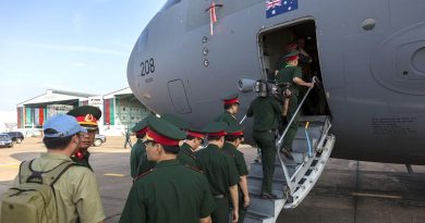 Personnel from the Vietnamese People's Army take the opportunity to look at a Royal Australian Air Force C-17A Globemaster at Tan Son Nhat International Airport. Photo by Corporal David Gibbs.