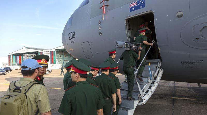 Personnel from the Vietnamese People's Army take the opportunity to look at a Royal Australian Air Force C-17A Globemaster at Tan Son Nhat International Airport. Photo by Corporal David Gibbs.