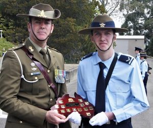 Leading Cadet Kieran Livingstone receives his award as the 602 Squadron Junior Cadet of the Year for 2018 from Lieutenant-Colonel Corey Shillabeer, CO 16 Air Land Regiment, RAA. Photo by Flying Officer (AAFC) Paul Rosenzweig.