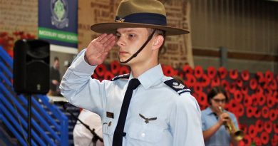 Catafalque Party Commander Cadet Flight Sergeant Tomasz Kocimski salutes during the Last Post. CFSGT Kocimski wears the General Flying Proficiency Badge – aged 17, he has qualified as a solo pilot in both powered aircraft and gliders. Photo by Flying Officer (AAFC) Paul Rosenzweig.