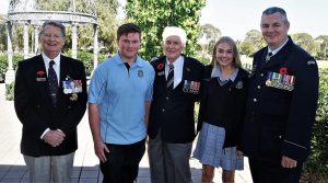Don Cameron (centre) at Modbury High School with his grandchildren Scott and Megan, with Brian Selby (SA/NT Branch President, NMBVAA) and Flying Officer (AAFC) Paul Rosenzweig, Headquarters 6 Wing, AAFC. They are pictured in the school’s Anzac Garden, which was established in 2015 to commemorate the Centenary of Anzac. Photo by Cadet Corporal Levi Schubert.