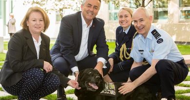 Squadron Leader Cindy Chawner, Darren Chester, Flight Lieutenant Sharne Kinleyside and Air Force Chaplain Col Barwise [dog not named, unfortunately]. Photo supplied.