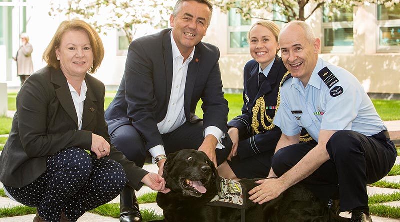 Squadron Leader Cindy Chawner, Darren Chester, Flight Lieutenant Sharne Kinleyside and Air Force Chaplain Col Barwise [dog not named, unfortunately]. Photo supplied.