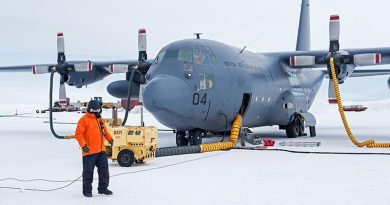 Sergeant David Wood in front of an C-130H(NZ) Hercules at Pegasus Airfield. The first Air Force C-130 Hercules ice flight of the season to Antarctica arrived at Pegasus Airfield, delivering cargo and returning to New Zealand with freight and passengers. NZDF photo.