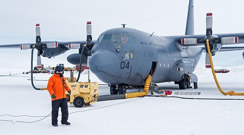 Sergeant David Wood in front of an C-130H(NZ) Hercules at Pegasus Airfield. The first Air Force C-130 Hercules ice flight of the season to Antarctica arrived at Pegasus Airfield, delivering cargo and returning to New Zealand with freight and passengers. NZDF photo.