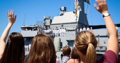 Family and friends wave goodbye to their loved ones on HMAS Ballarat as the ship sails from Fleet Base West, WA, to commence a nine-month operational deployment to the Middle East. Photo by Leading Seaman Kylie Jagiello.