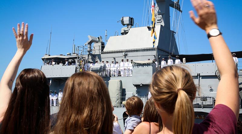 Family and friends wave goodbye to their loved ones on HMAS Ballarat as the ship sails from Fleet Base West, WA, to commence a nine-month operational deployment to the Middle East. Photo by Leading Seaman Kylie Jagiello.