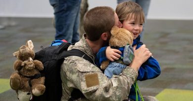 Corporal Hannah Bristow hugs her four-year-old son Leo after arriving home from the Sinai Peninsula. NZDF photo.