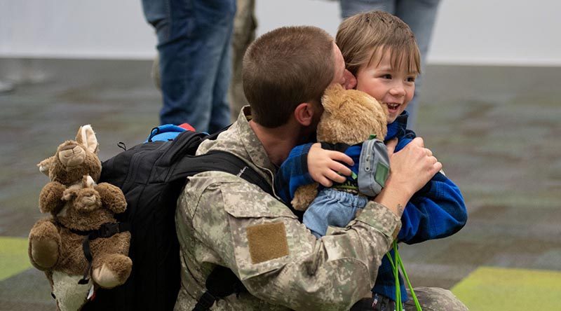 Corporal Hannah Bristow hugs her four-year-old son Leo after arriving home from the Sinai Peninsula. NZDF photo.