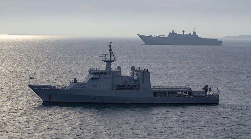 Royal New Zealand Navy offshore patrol vessel HMNZS Otago and Royal Australian Navy amphibious ship HMAS Adelaide at anchor off Port Moresby as part of international support to APEC 2018. ADF photo.