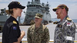 Commanding Officer HMNZS Otago Lieutenant Commander Lorna Bray, Commanding Officer of US Coast Guard Port Security Unit 305 Commander Michael McCarthy and Australian APEC maritime support component commander Captain Paul O'Grady meet aboard HMAS Adelaide. ADF photo.