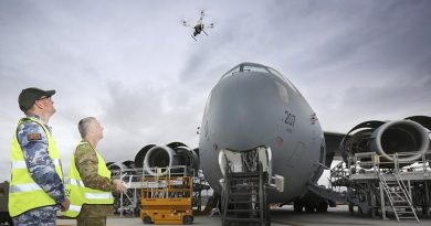 Australian Army Sergeant Andrew Whitelaw, from 16 Air Land Regiment and Corporal Kelvin Green, Aircraft Surface Finisher at Royal Australian Air Force No.36 Squadron, launch a drone to inspect the condition of paint on the upper surfaces of a C-17A Globemaster at RAAF Base Amberley. Photo by Corporal Kylie Gibson.