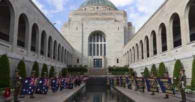 Queen's and Regimental Colours of the Royal Australian Regiment displayed at the Pool of Remembrance following the RAR's 70th-anniversary parade at the Australian War Memorial. Photo by Sergeant Ray Vance.