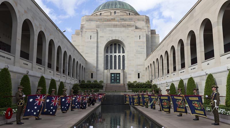 Queen's and Regimental Colours of the Royal Australian Regiment displayed at the Pool of Remembrance following the RAR's 70th-anniversary parade at the Australian War Memorial. Photo by Sergeant Ray Vance.