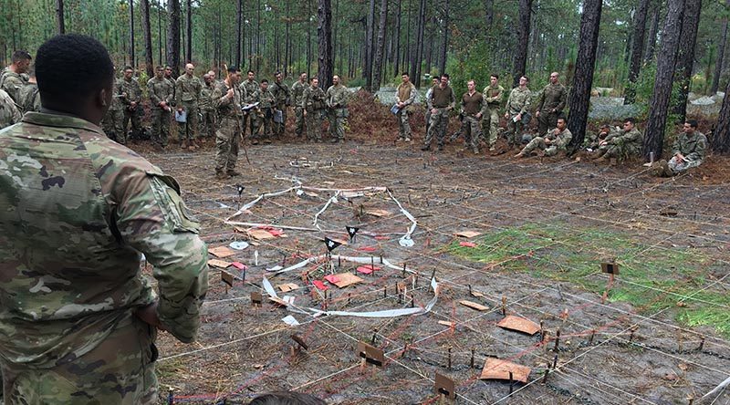 US and New Zealand soldiers listen to a situation briefing at the Joint Readiness Training Centre in Fort Polk, Louisiana. Photo supplied by NZDF.