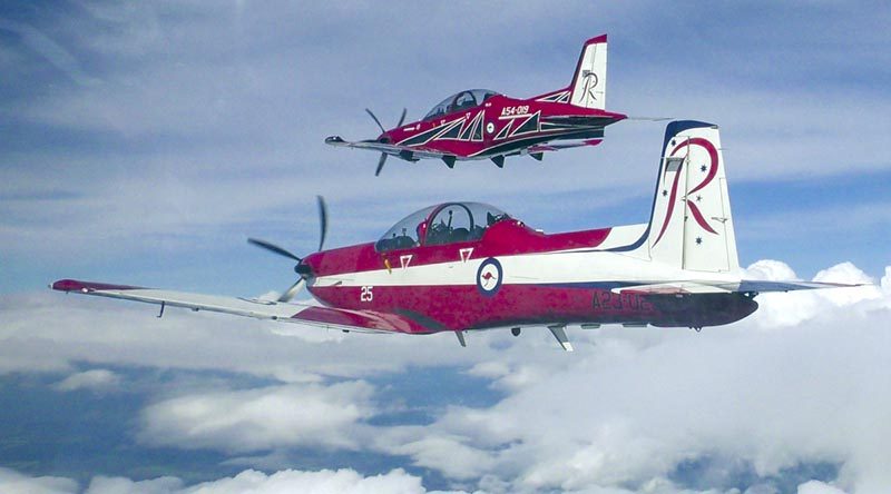 A Royal Australian Air Force PC-9 aircraft trails a new PC-21 aircraft with new Roulettes colour scheme. Photo by Flight Lieutenant Daniel Armstrong.