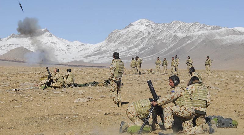 Australian soldiers from Mortar Platoon 2RAR fire a salvo during operations in the Chora Valley, Afghanistan. Photo by Corporal Hamish Paterson.