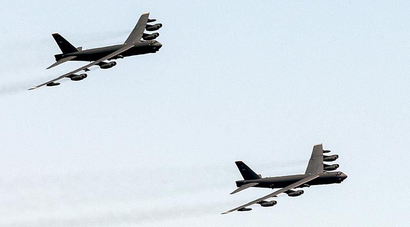 A pair of United States Air Force B-52 bombers fly over Canberra during a ceremony to mark the 50th anniversary of the Battle of Long Tan. Photo by Petty Officer Phil Cullinan.